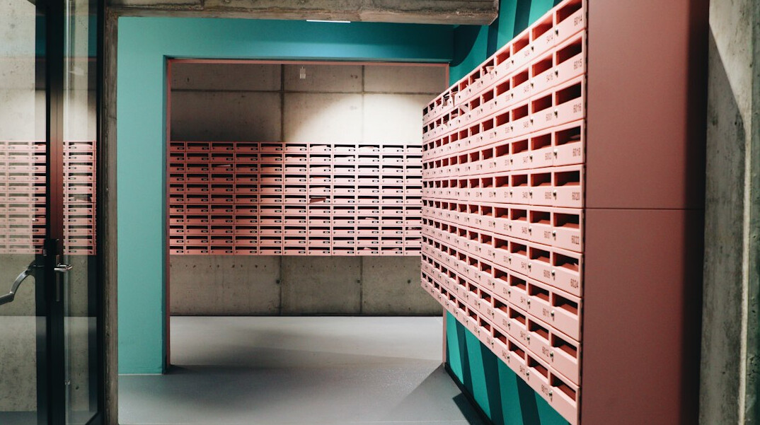 Rows of archival shelves with labeled boxes and old files