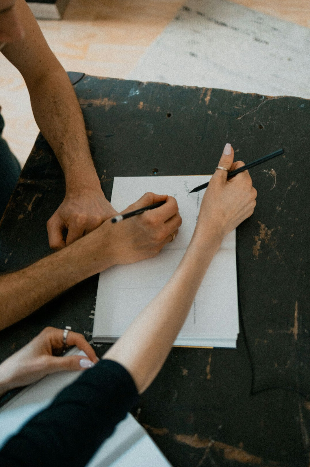 people filling out survey forms