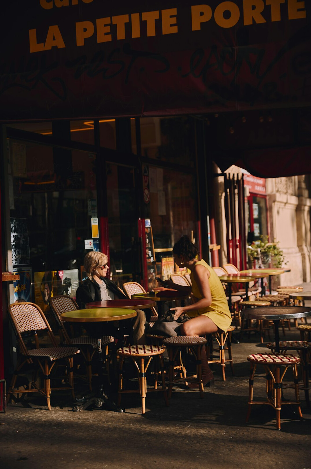 people in conversation at cafe